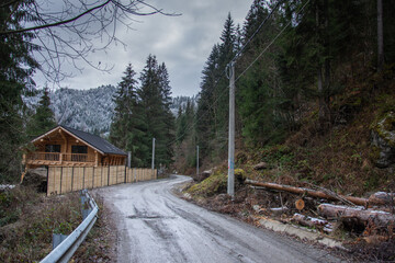 Wall Mural - unpaved country road  near Colibita Lake in Bistrita, Romania, December 2020