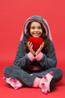 © be free - Happy kid hold big red valentines heart sitting in cosy pajamas, cardiovascular