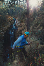 Man Taking A Selfie While Dangling From A Rope Canyoning