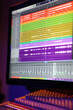 Close up of a DAW audio software arrangement being edited live in a professional recording studio.