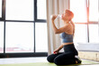 © alfa27 - athlete woman in sportswear drinking water after sport exercises, in bright room. motivation, sport concept