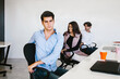 © Marcos - latin business people meditating and doing yoga in office in Mexico city