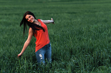 Young brunette beautiful girl enjoying the spring time