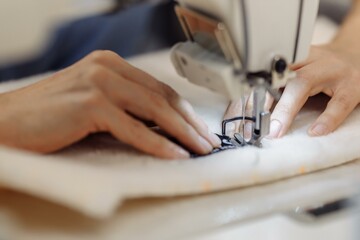 sewing machine scribbling fabric. tailoring at the factory