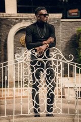 Wall Mural - portrait of african model smoking cigar and posing for photography