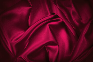 Wall Mural - Red silk satin background. Beautiful soft wavy folds on smooth shiny fabric. Anniversary, Christmas, wedding, valentine, event, celebration concept. Red luxury background with copy space for design.