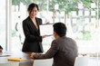 © Natee Meepian - Businesswoman presenting new project to partners, Business Meeting Concept.