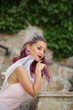 © angel_nt - Portrait of a bride with purple hair close-up. A woman in a beautiful dress is resting