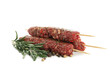 © Atlas - Skewers with raw minced meat or lula kebab, herb and spices isolated on white background