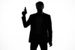 © SHOTPRIME STUDIO - shadow of a man with a gun in his hands aiming detective crime light background
