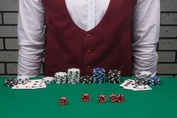 beautiful concept of poker chips on a green cloth in front of the dealer