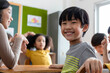 © JR-50 - Asian elementary school kids studying in a classroom. The boy smiled