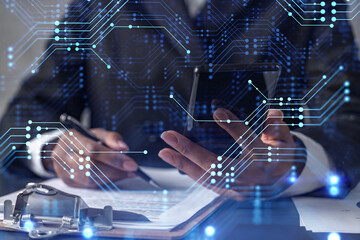 African American businesswoman is signing the contract to create a start up for the conference and gain investments for innovative service. Checking the details at smartphone. Hologram tech graphs.