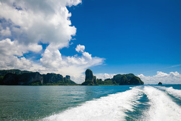 Beautiful landscape with islands in the Adaman Sea with azure water and sky with clouds. Thailand