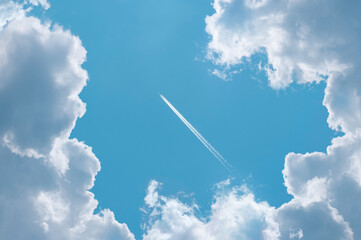 Wall Mural - clouds in the sky surrounded and the planes with jet smoke.