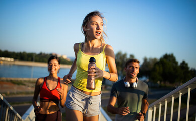 Friends fitness training together outdoors living active healthy