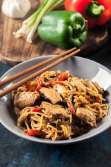 Wall Mural - Chicken chow mein. Fried noodles with chicken and vegetables