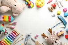 Frame Made Of Different Toys On Light Background, Flat Lay. Space For Text