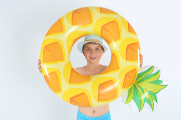 Canvas Print - Cute little child in beachwear with bright inflatable ring on white background