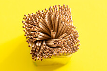 Wooden Toothpicks On Yellow Background Closeup