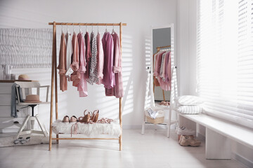 Poster - Rack with stylish women's clothes indoors. Interior design