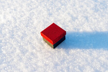Red Black Gift Flat Lay On The Snow. Valentine's Day , Place For Text, Love Heart. Winter Outdoors.
