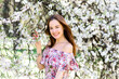 © Ivan Zelenin - Portrait of beautiful red-haired young woman in white dress in spring flowers, blossom