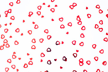 Wall Mural - Valentine's Day background February 14th. Red hearts confetti on white background. Valentines day creative concept. Flat lay, top view, copy space.