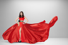 Woman in luxury red silk dress