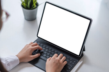 Businesswoman using digital tablet to working at home. blank white screen.