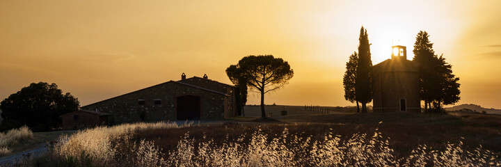 Wall Mural - panorama of vitaleta chapel at sunset, tuscan landscape near san quirico d'orcia, siena, tuscany, it