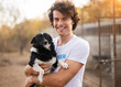 © kegfire - Happy male volunteer hugging dog
