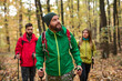 © kegfire - Bearded traveler walking in forest with friends