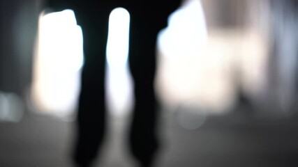 male silhouette going to bright light. man in underground go to the future. male' foot go to light. 