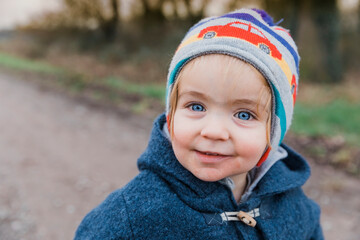 Portrait of happy toddler girl with blue eyes