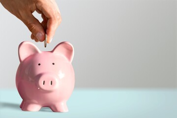 Sticker - Businessman putting coin into the piggy bank