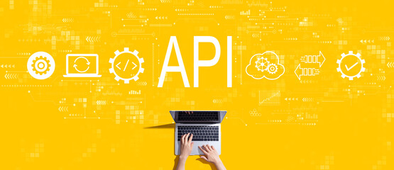 API - application programming interface concept with person working with a laptop