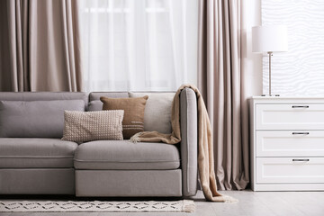 Modern living room interior with beautiful curtains on window