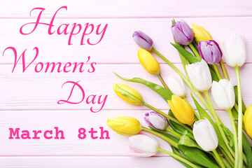 Wall Mural - Bouquet of tulips with text Happy Womens Day on pink wooden table