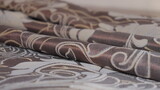Fototapeta Paryż - Curtain fabric folds close up.Technological process of sewing curtains.