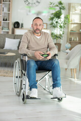 Wall Mural - happy disabled man playing computer games