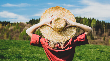 Sticker - Beautiful girl in red dress and hat have a carefree time on meadow