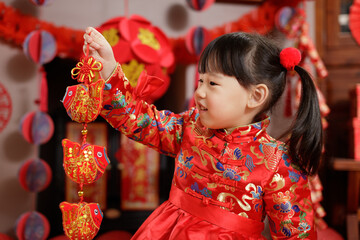 Wall Mural - young chinese girl with traditional dressing up celebrate Chinese new year