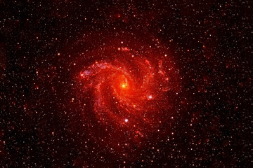 Wall Mural - small red galaxy on a dark background. elements of this image were furnished by nasa.
