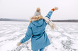 © Bostan Natalia - Woman weaving, walking on ice on a frozen lake on winter day.