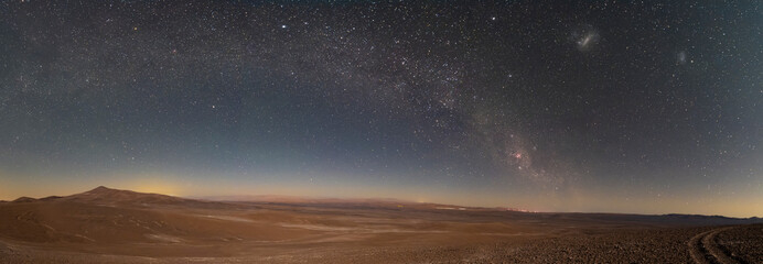 Wall Mural - an amazing panoramic view of the milky way above atacama desert vast sand fields. an awe night sky v