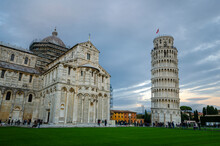 Panorama Of Pisa Cathedral (Duomo Di Pisa) With Leaning Tower (Torre Di Pisa) And Baptistery Of St. John (Battistero Di Pisa) In Tuscany, Italy At Sunset. One Of The Main Landmark In Italy.