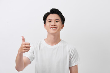 Wall Mural - Happy man giving thumbs up sign portrait on white background