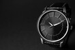Luxury wrist watch on black background, closeup. Space for text