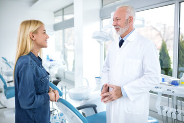 Wall Mural - Satisfied patient and dentist after treatment